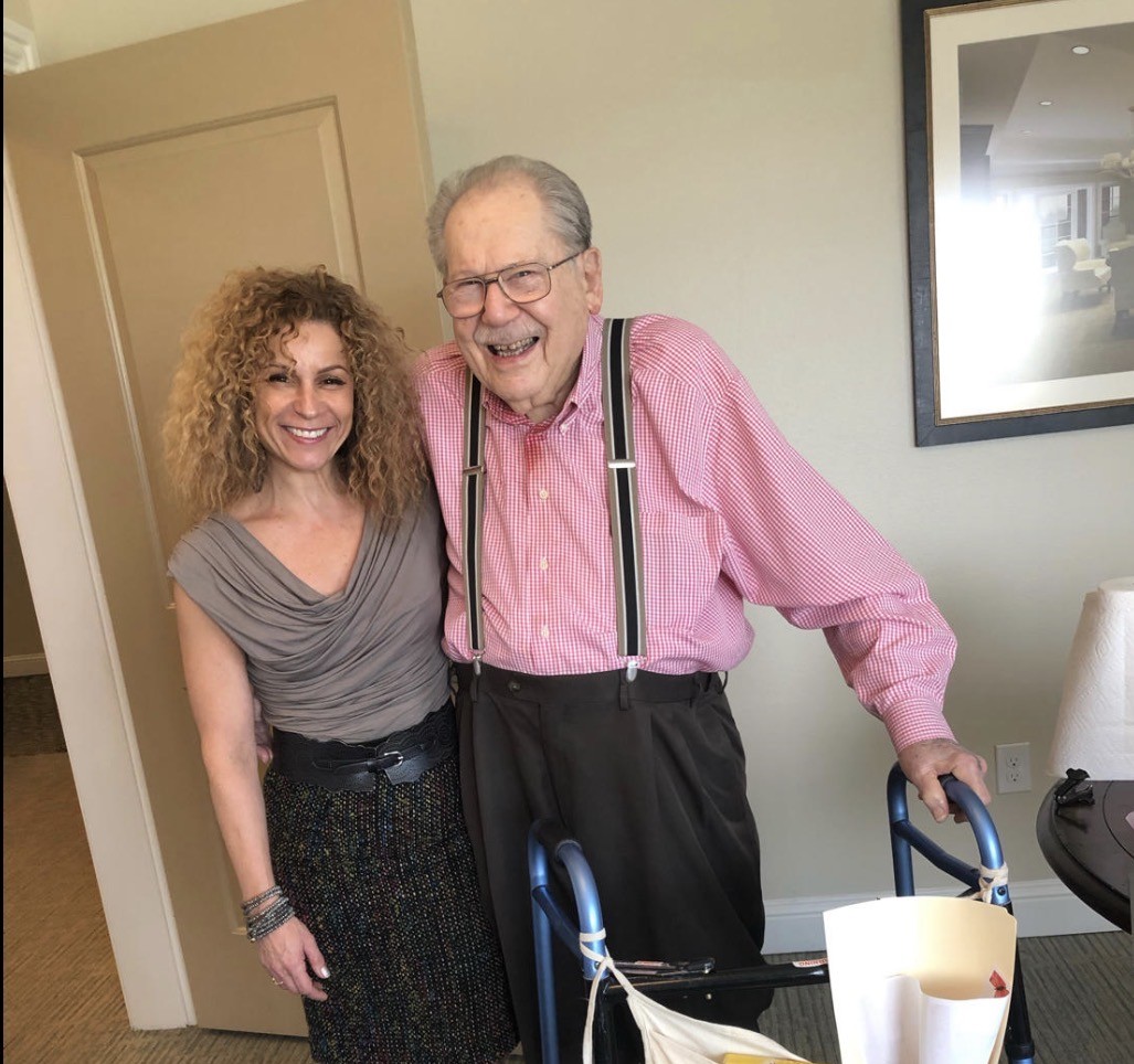 Marci with a client at a senior living community